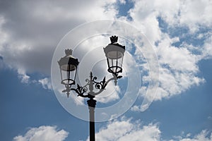 vintage street light on beautiful cloudy sky background