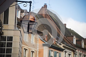 vintage street light on historic building facade background in Mulhouse - France