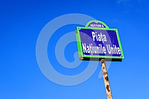 Vintage street sign showing Piata Natiunile Unite (United Nations Square) displayed on an street in the city center of