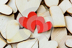 Vintage style of 2 red hearts with wooden hearts