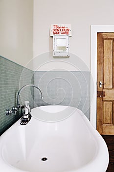 Vintage style bathroom with quirky retro safety sign