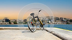 Vintage style bicycle standing on Pier of marina Zeas
