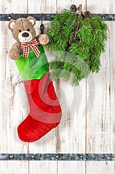 Vintage style christmas decoration. Red Santas hat, Teddy Bear