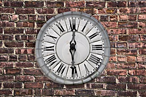 Vintage style clock on a red brick wall