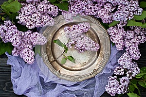 Vintage style composition with lilac flowers