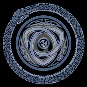 Vintage style design. A coiled Ouroboros snake biting its own tail and ancient Celtic pattern