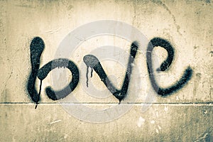 Vintage style with grungy cement wall with word LOVE