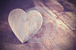 Vintage style heart on rustic wooden background, copy space