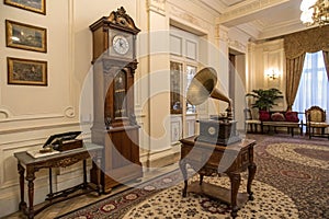 Classical interior with grandfather clock and gramophone