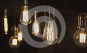 Vintage style light bulbs hanging from the ceiling. Old Edison bulb