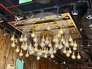 Vintage style light bulbs hanging from a wooden ceiling