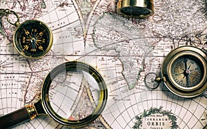 Vintage style navigational objects on an old world map