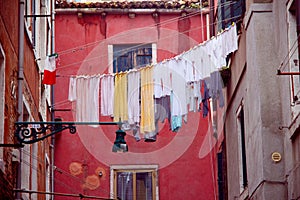 vintage style picture of an old alley with laundry lines in Venice, Italy