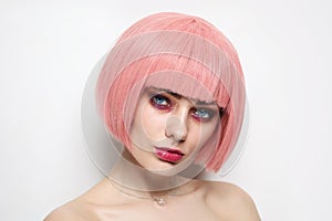 Vintage style portrait of beautiful woman with pink hair and fancy glitter makeup