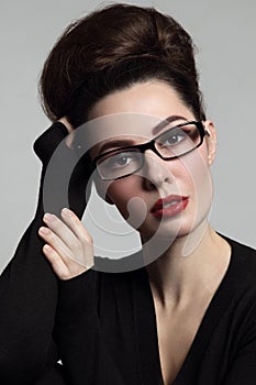 Vintage style portrait of young beautiful woman in gla