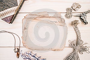 Vintage style rustical mockup with sheet of old blank paper on a wooden texture photo