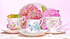 Attractive fine bone china tea cups on a pink background