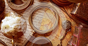 Vintage style travel and adventure. Vintage old compass and other vintage items on the table