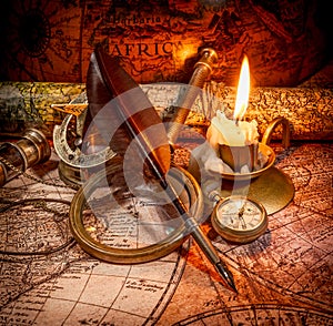 Vintage style travel and adventure. Vintage old compass and other vintage items on the table