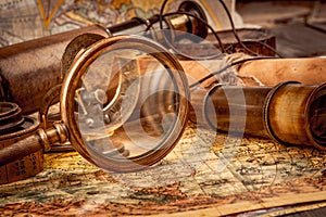 Vintage style travel and adventure. Vintage old compass and other vintage items on the table