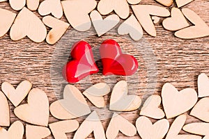 Vintage style of two red hearts with Wooden hearts on a wooden