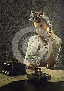 Vintage style - Woman talking on the phone with retro dial phone