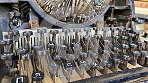 Vintage styled retro machine. Close up photo of antique typewriter keys,