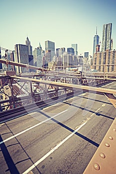 Vintage stylized Manhattan seen from Brooklyn Bridge, NYC, USA