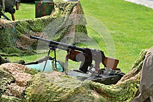 Vintage submachine guns and handguns on display in the historic summer on a sunny day