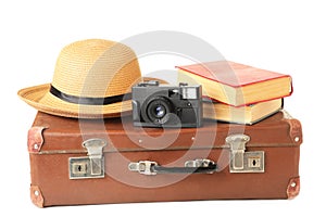 Vintage suitcase and accessories isolated on white background