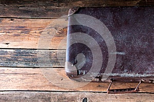 Vintage suitcase on wooden floor. Copyspace. Top view