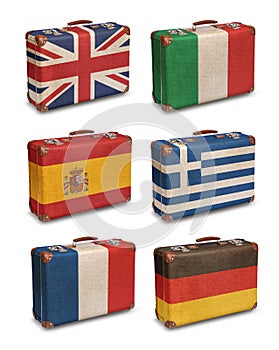 Vintage suitcases with European flags on white