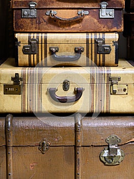 Vintage suitcases and trunk stacked together