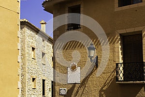 Vintage sundial clock on the old house wall at the Old Town street in Relleu, Spain