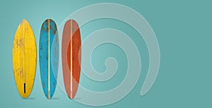 Vintage surfboard on color background.