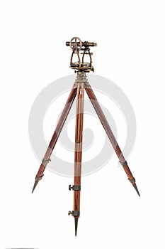 Vintage Surveyor's Level (Transit, Theodolite) on a Wooden Tripod isolated on White.