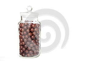 Vintage sweet shop jar full of retro aniseed ball sweets