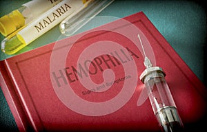 Vintage Syringe On A Book Of Hemophilia