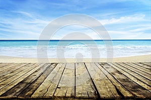 Vintage table top with blur tropic beach and sea. Summer bokeh background and tabletop for product montage display. Sunny paradise