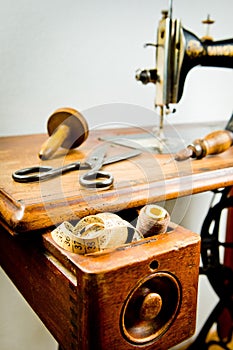 Vintage tailor`s tools on old sewing machine