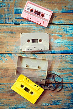 Vintage tape cassette recorder on wood background