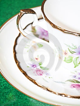 Vintage tea or coffee cup with floral pattern