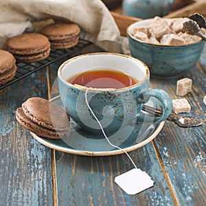 Vintage tea Cup on blue wooden background