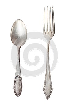 Vintage tea spoon and fork isolated on a white background. Retro silverware