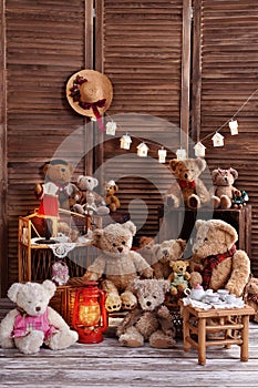 Vintage teddy bear family sitting at the tea table