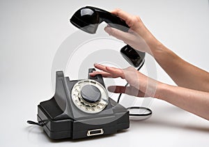Vintage telephone being picked up