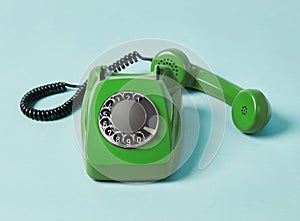 Vintage telephone on blue