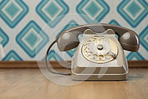 Vintage telephone on diamond wallpaper photo