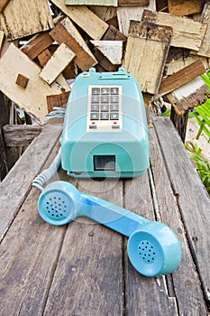 Vintage telephone on old wood table