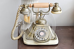Vintage telephone on wood table background